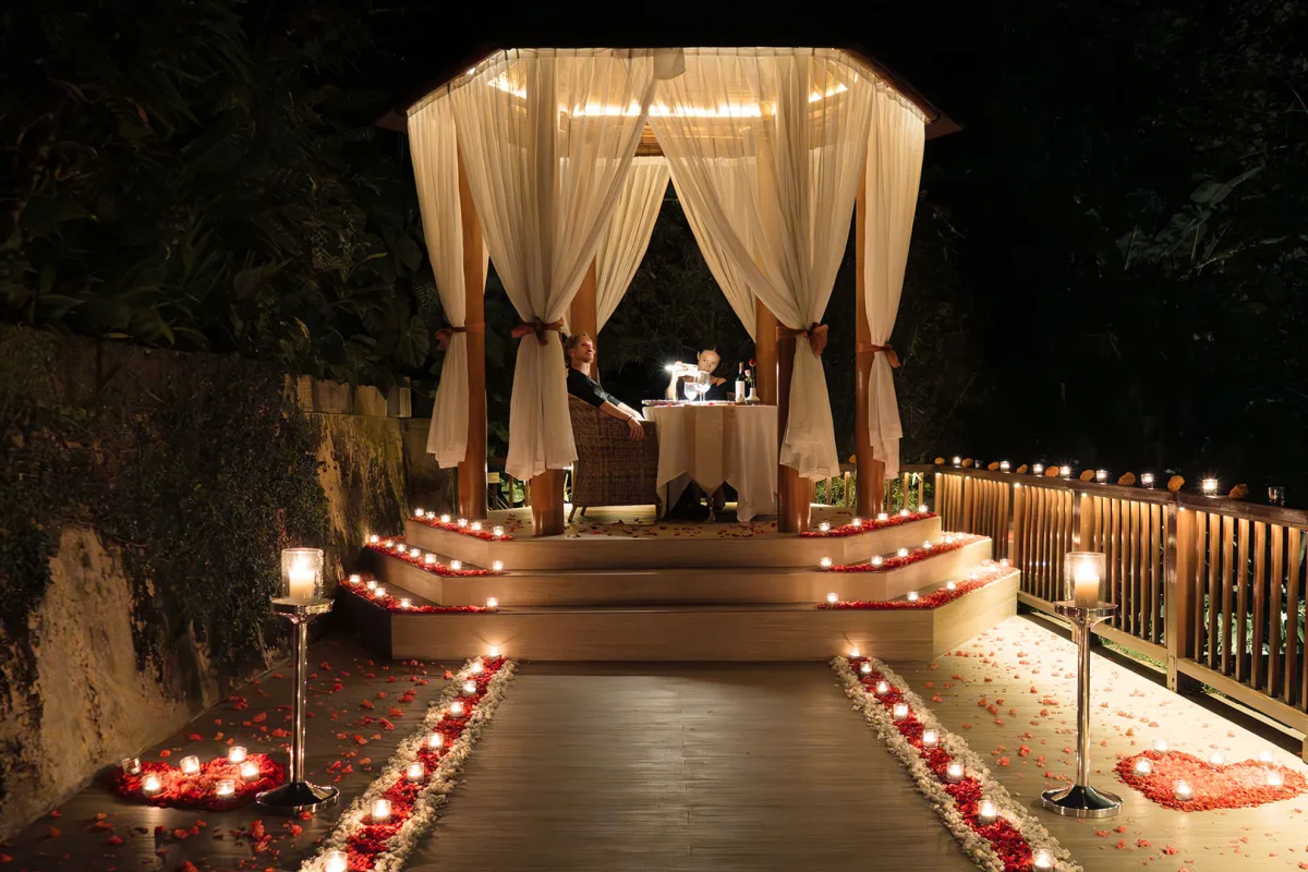 Romantic candlelit dining by the chapel at Nandini Jungle