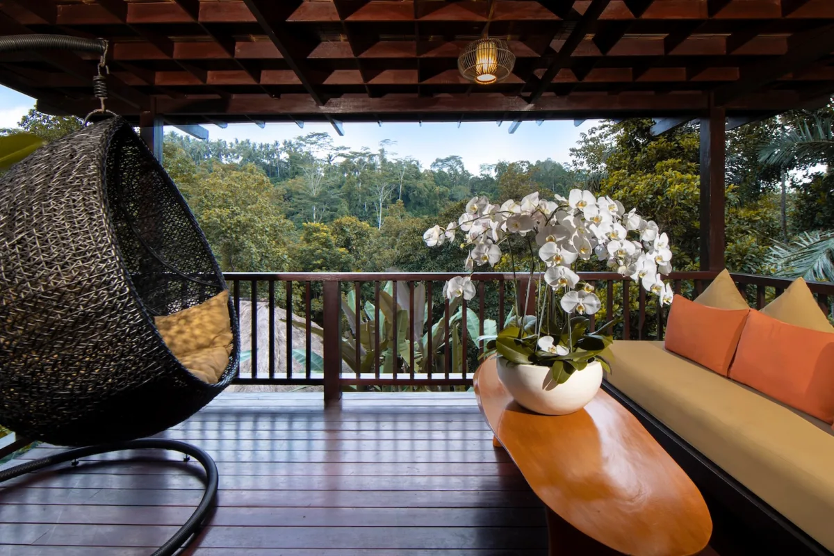 Private balcony of the Jungle View Villa with lush rainforest views in Ubud, Bali