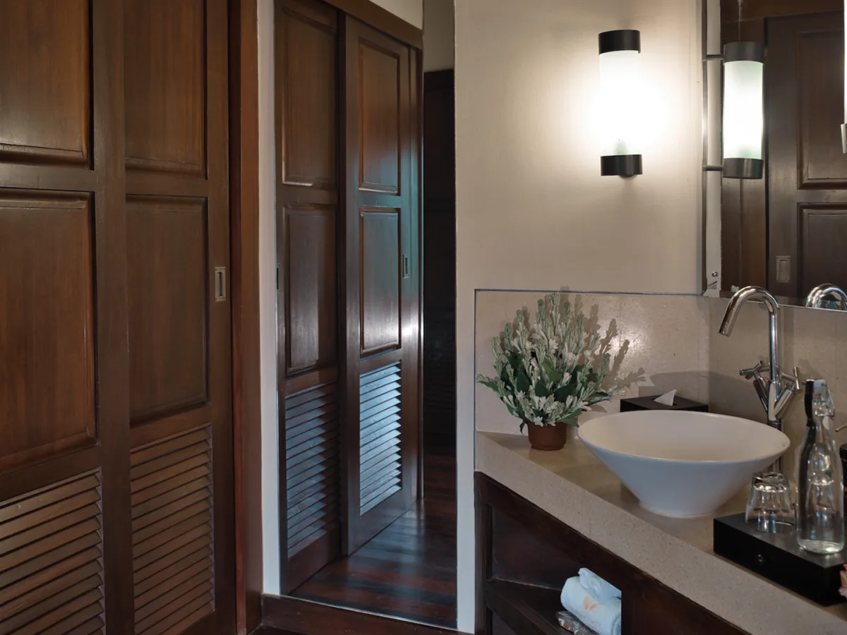 Jungle View Villa bathroom with vanity, mirror, and wooden wardrobe in Ubud, Bali