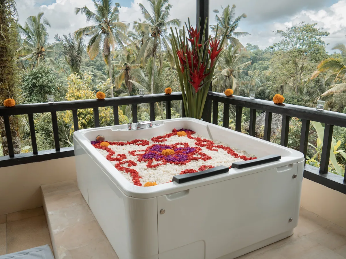 Private balcony jacuzzi at the Panoramic Corner Jacuzzi Royal Suite with lush jungle views in Ubud, Bali