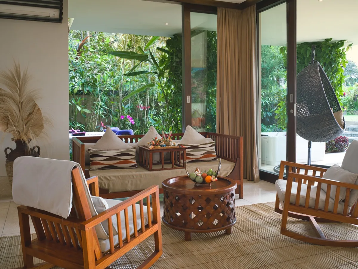 Presidential Royal Suite living area with garden terrace, lounge seating, and tropical views in Ubud, Bali