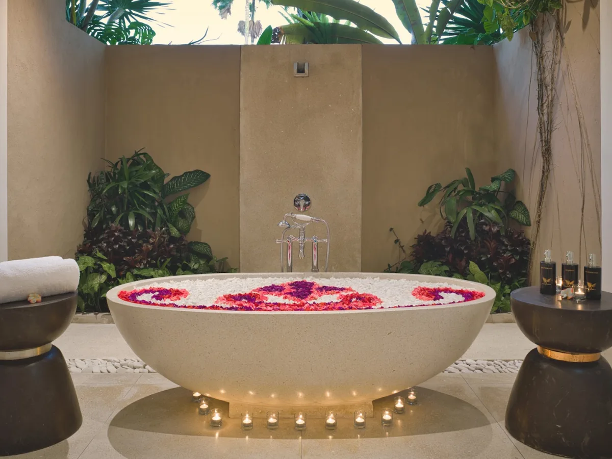 Outdoor flower bath with candles at the Presidential Royal Suite in Ubud, Bali