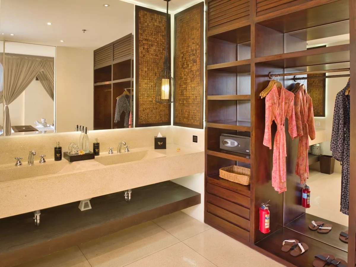 Private Garden Royal Suite bathroom with double vanity, mirrors, and wooden wardrobe in Ubud, Bali