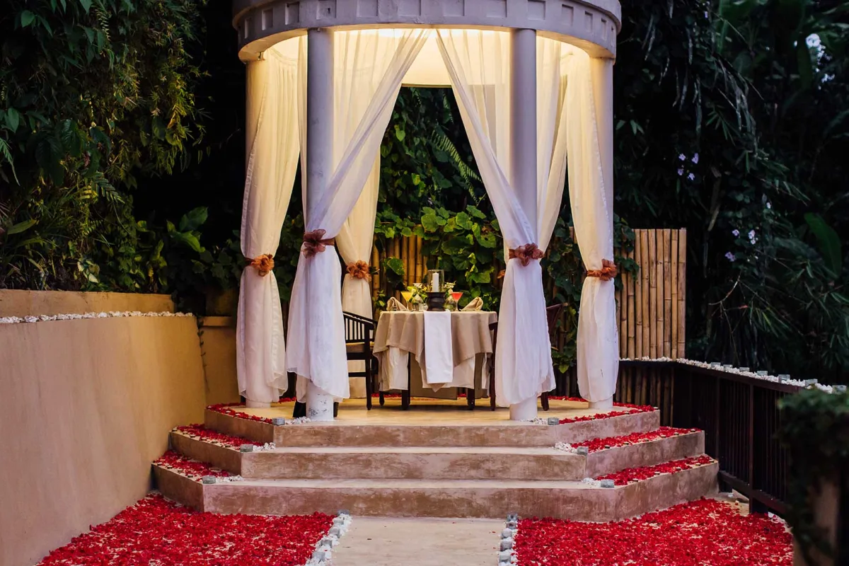 Romantic candlelit dining setup at The Chapel surrounded by jungle at Nandini Jungle by Hanging Gardens