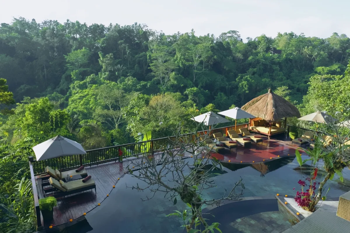 Couple relaxing and reading inside a luxury jungle villa at Nandini Jungle by Hanging Gardens in Ubud