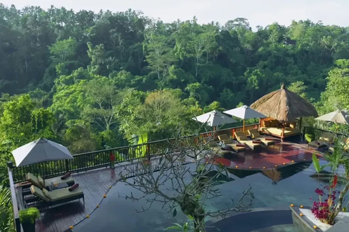 Couple relaxing and reading inside a luxury jungle villa at Nandini Jungle by Hanging Gardens in Ubud