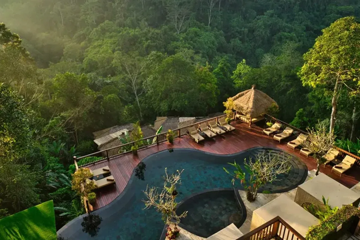 Jungle swimming pool and luxury villas at Nandini Jungle by Hanging Gardens in Ubud Bali.