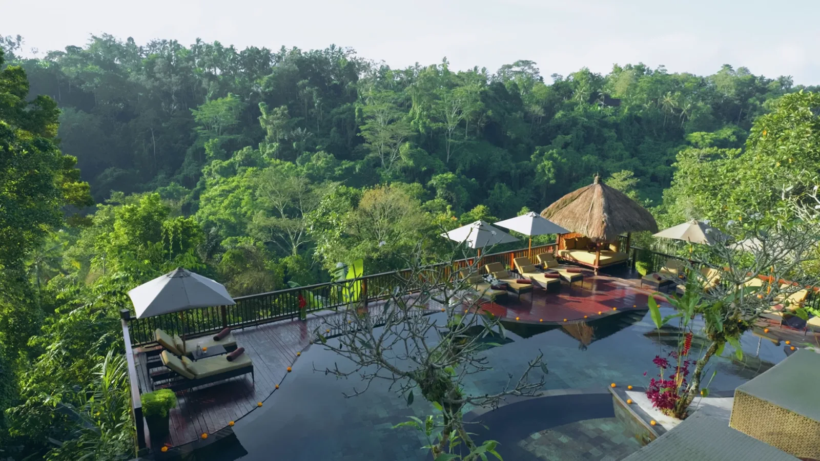 Couple relaxing and reading inside a luxury jungle villa at Nandini Jungle by Hanging Gardens in Ubud