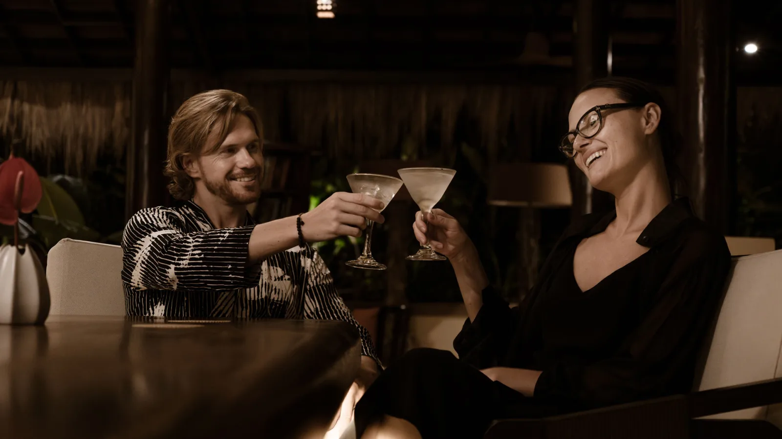 Two guests enjoying cocktails at Wild Ginger Restaurant at Nandini Jungle by Hanging Gardens.