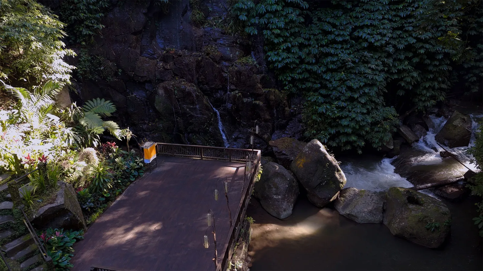 Sacred riverside deck surrounded by tropical jungle at Nandini Jungle