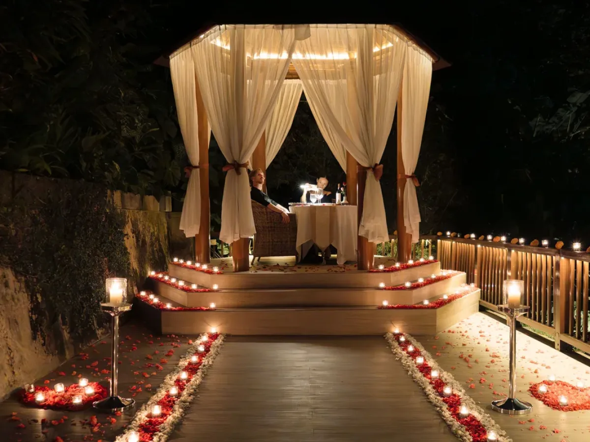 Romantic candlelit dining by the chapel at Nandini Jungle by Hanging Gardens in Bali.